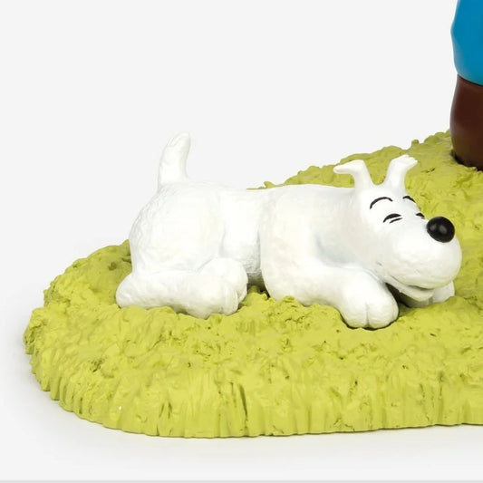 Tintin and Snowy Sitting On The Grass